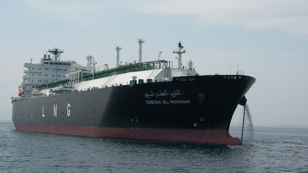 The LNG tanker ‘CHEIKH EL MOKRANI’ is shown at sea, with water cascading from the bow, illustrating the vessel’s readiness and operations in LNG transport.