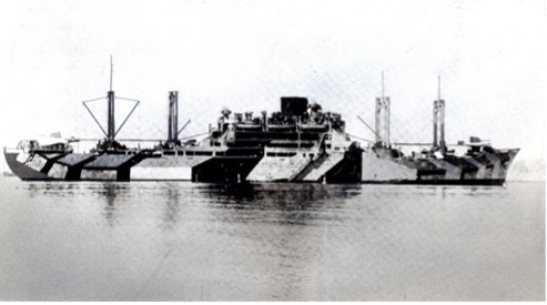 A historic Aikokumaru as an armed auxiliary cruiser in camouflage paint, floating on a calm sea with minimal visible details.